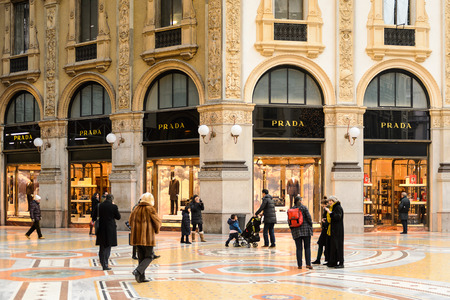 MILAN, ITALY - DEC 23, 2014: Prada boutique in Galleria Vittorio Emanuele II, one of the world's oldest shopping malls. The gallery is built between 1865 and 1877 by Giuseppe Mengoniのeditorial素材