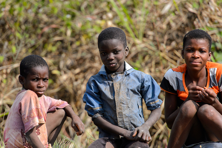 BRONG AHAFO, GHANA - JAN 15, 2017: Unidentified Ghanaian children sit on the ground. Ghana children suffer of poverty due to the bad economy.のeditorial素材