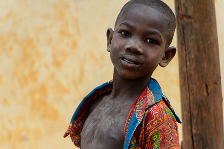 BOABENG, GHANA - JAN 15, 2017: Unidentified Ghanaian boy looks ahead in the local village. Ghana...