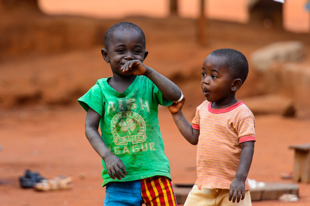 BOABENG, GHANA - JAN 15, 2017: Unidentified Ghanaian children play in the yard in the local village. Ghana children suffer of poverty due to the bad economy.のeditorial素材