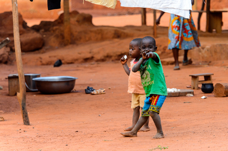 BOABENG, GHANA - JAN 15, 2017: Unidentified Ghanaian children play in the yard in the local village. Ghana children suffer of poverty due to the bad economy.のeditorial素材