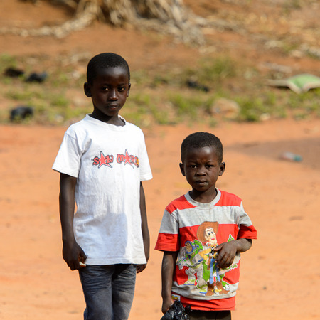 TECHIMAN, GHANA - JAN 15, 2017: Unidentified Ashanti boys look ahead in the local village. Ashante are ethnic group of Ghanaのeditorial素材