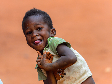 BOABENG, GHANA - JAN 15, 2017: Unidentified Ghanaian little boy looks ahead in the local village. Ghana children suffer of poverty due to the bad economyのeditorial素材