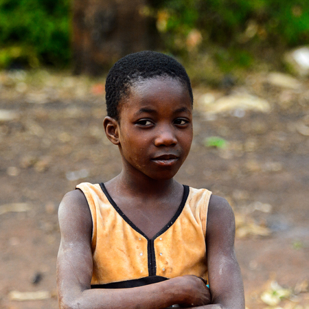 BOABENG, GHANA - JAN 15, 2017: Unidentified Ghanaian little boy looks ahead in the local village. Ghana childen suffer of poverty due to the bad economy.のeditorial素材