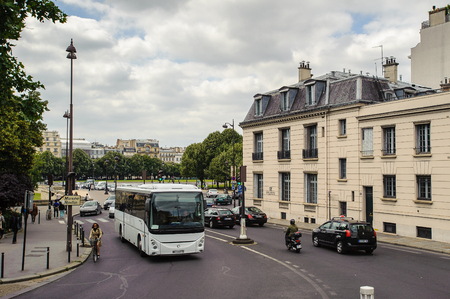 PARIS, FRANCE - JUN 17, 2014: Achitecture and traffic on the street in Paris, France. Paris is one of the most popular touristic destinations in the worldのeditorial素材