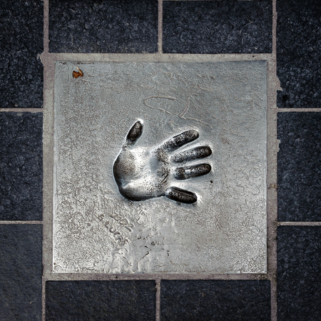 CANNES, FRANCE - JUN 25, 2014: hand mark on the alley of fame in Cannes, Cote d'Azur, Franceのeditorial素材