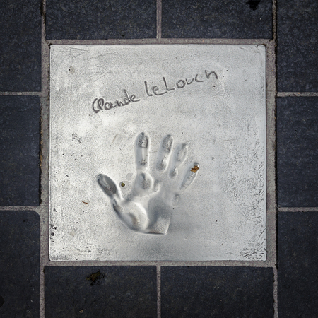 CANNES, FRANCE - JUN 25, 2014: Claude Lelouch hand mark on the alley of fame in Cannes, Cote d'Azur, Franceのeditorial素材