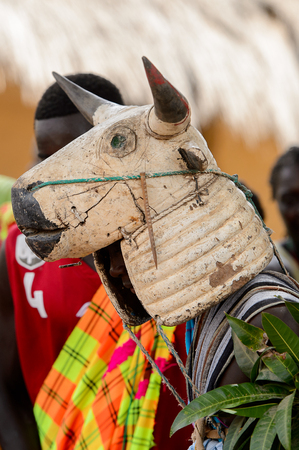 ORANGO ISL., GUINEA BISSAU - MAY 3, 2017: Unidentified local A man in a cow mask dances  during Vaca Bruto, traditional Mask danceのeditorial素材