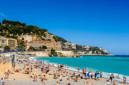 NICE, FRANCE - JUNE 25, 2014: Beach of the Mediterranean sea, Cote d Azur, Nice, France. Nice is the capital of the Alpes Maritimes departementのeditorial素材