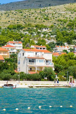 DALMATIA, REGION OF SPLIT, CROATIA - AUG 20, 2014: Architecture of Dalmatia, the Adriatic coast. Coast of the Adriatic Sea in Dalmatia became a popular destination for millions of touristsのeditorial素材