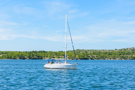 SIBENIK, CROATIA - AUG 26, 2014: Boat at the harbor in Sibenic, Croatia. Sibenic is a popular...