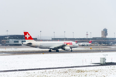 ZURICH, SWITZERLAND - JAN 26, 2015: Plane of the Swiss International Air Lines in the Zurich Kloten Airport, the largest international airport of Switzerlandのeditorial素材