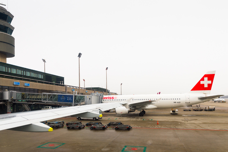 ZURICH, SWITZERLAND - JAN 26, 2015: Plane of the Swiss International Air Lines, flag carrier airline of Switzerland in the Zurich Kloten Airport, the largest international airport of Switzerlandのeditorial素材