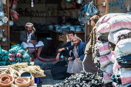 SANA'A, YEMEN - JAN 11, 2014: Unidentified Yemeni people work at the market. People of Yemen suffer of poverty due to the unstable political and poor economical situationのeditorial素材