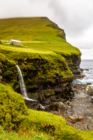 Waterfall on Kalsoy, an island in the north-east of the Faroe Islandsの写真素材