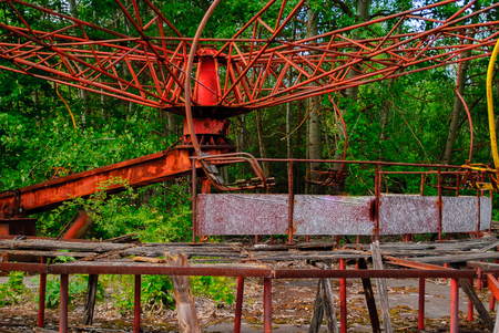 Damaged carousel in the former amusement park in Pripyat, a ghost town in northern Ukraine, evacuated the day after the Chernobyl disaster on April 26, 1986の写真素材