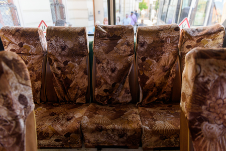 Seats in a Soviet Russian old fashioned passenger bus made in 1983の写真素材