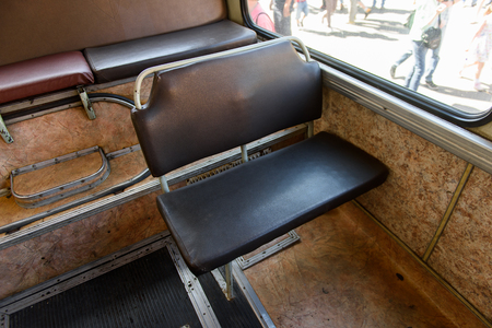 Brown seats in the Ukrainian old fashioned passenger bus of 1992の写真素材