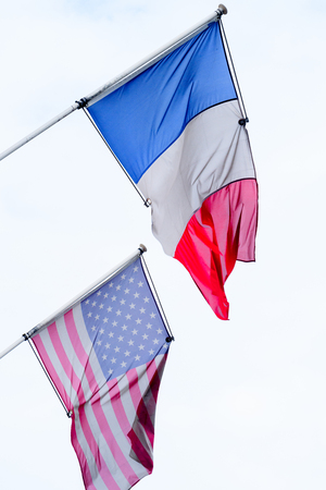 American and French flags in Paris, the capital of Franceの写真素材
