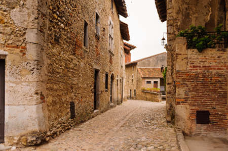 Narrow street in  Perouges, France, a medieval walled town, a popular touristic attraction.の写真素材