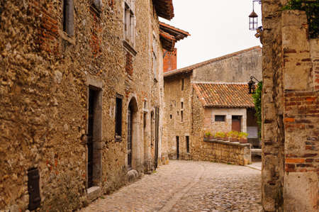 Narrow street in  Perouges, France, a medieval walled town, a popular touristic attraction.の写真素材