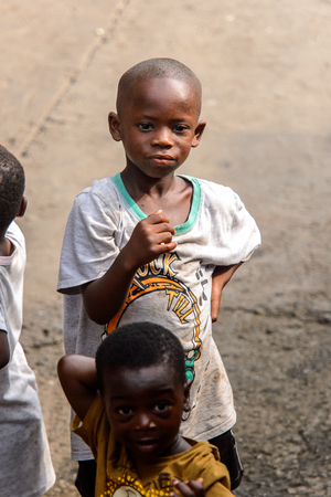 ACCRA, GHANA - JAN 8, 2017: Unidentified Ghanaian little boy looks thoughtfully into the distance. Children of Ghana suffer of poverty due to the economic situationのeditorial素材