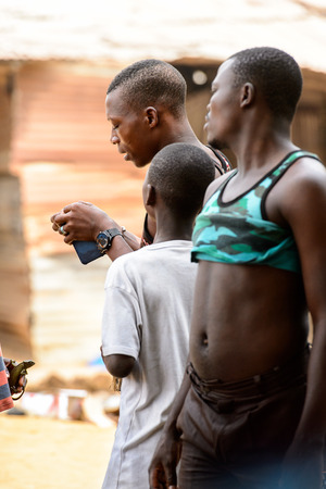 LOME, TOGO - Jan 9, 2017: Unidentified Togolese  group of boys at the Lome fetish market. Togo people suffer of poverty due to the bad economyのeditorial素材
