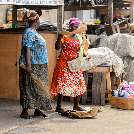 LOME, TOGO - Jan 9, 2017: Unidentified Togolese women work at the Lome port. Togo people suffer of...
