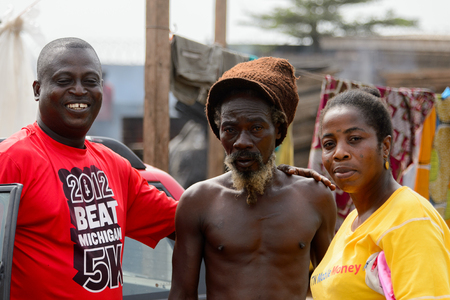 ACCRA, GHANA - Jan 8, 2017: Unidentified Ghanaian people stand at the local market. People of Ghana suffer of poverty due to the economic situationのeditorial素材