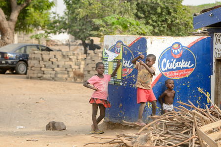 ACCRA, GHANA - Jan 8, 2017: Unidentified Ghanaian children play on the street. Children of Ghana suffer of poverty due to the economic situationのeditorial素材