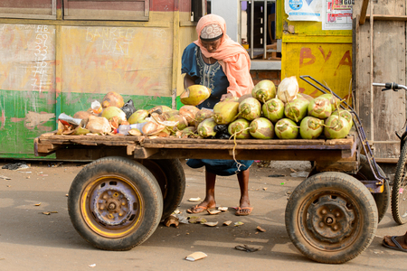 ACCRA, GHANA - Jan 8, 2017: Unidentified Ghanaian woman  sells food on the street. People of Ghana suffer of poverty due to the economic situationのeditorial素材