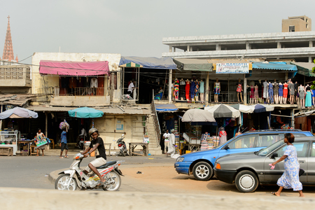 LOME, TOGO - Jan 9, 2017: Unidentified Togolese group of people work in shops. Togo people suffer of poverty due to the bad economyのeditorial素材