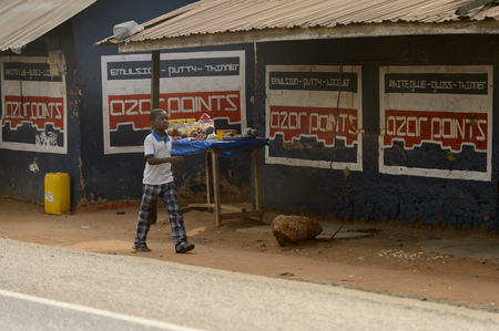 ACCRA, GHANA - Jan 8, 2017: Unidentified Ghanaian little boy walk on the street. Children of Ghana suffer of poverty due to the economic situationのeditorial素材
