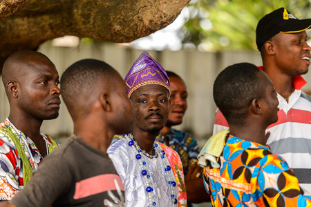 OUIDAH, BENIN - Jan 10, 2017: Unidentified Beninese men in colored clothes at the voodoo festival,...