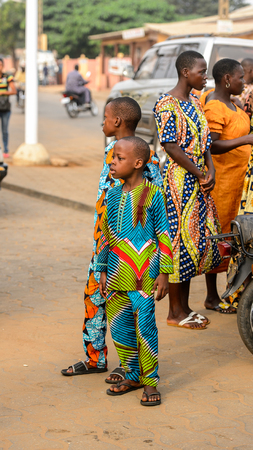 OUIDAH, BENIN - Jan 10, 2017: Unidentified Beninese  little boys in colored suits stand at the voodoo festival, which is anually celebrated on January, 10th.のeditorial素材