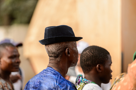 OUIDAH, BENIN - Jan 10, 2017: Unidentified Beninese man in hat from behind at the voodoo festival, which is anually celebrated on January, 10th.のeditorial素材