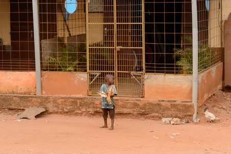 LOME, TOGO - Jan 9, 2017: Unidentified Togolese little boy looks around. Togo children suffer of poverty due to the bad economyのeditorial素材