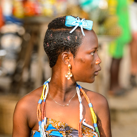 OUIDAH, BENIN - Jan 10, 2017: Unidentified Beninese woman in national suit looks ahead at the voodoo festival, which is anually celebrated on January, 10th.のeditorial素材