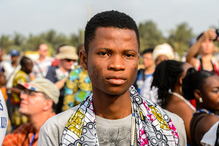 OUIDAH, BENIN - Jan 10, 2017: Unidentified Beninese  man with scars on his cheeks looks ahead at the voodoo festival, which is anually celebrated on January, 10th.のeditorial素材
