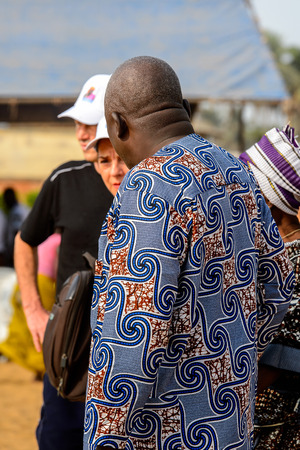 OUIDAH, BENIN - Jan 10, 2017: Unidentified Beninese  man in colored clothes from behind at the voodoo festival, which is anually celebrated on January, 10th.のeditorial素材