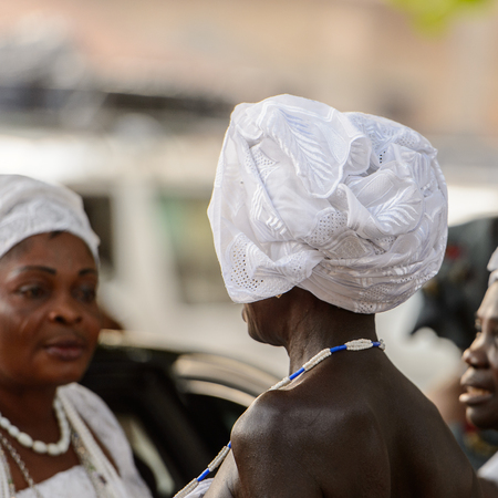 OUIDAH, BENIN - Jan 10, 2017: Unidentified Beninese woman in national suit wears necklace and earings at the voodoo festival, which is anually celebrated on January, 10th.のeditorial素材