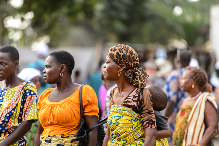 OUIDAH, BENIN - Jan 10, 2017: Unidentified Beninese  group of people stare at something at the voodoo festival, which is anually celebrated on January, 10th.のeditorial素材