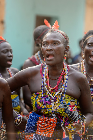OUIDAH, BENIN - Jan 10, 2017: Unidentified Beninese woman in national suit wears necklace and earings at the voodoo festival, which is anually celebrated on January, 10th.のeditorial素材