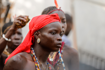 OUIDAH, BENIN - Jan 10, 2017: Unidentified Beninese woman wears necklace and earings at the voodoo...