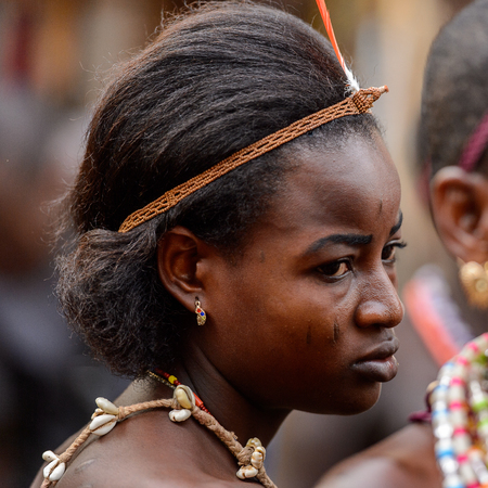 OUIDAH, BENIN - Jan 10, 2017: Unidentified Beninese woman wears necklace and earings at the voodoo...