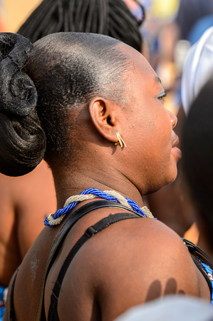 OUIDAH, BENIN - Jan 10, 2017: Unidentified Beninese woman in national suit wears necklace and earings at the voodoo festival, which is anually celebrated on January, 10th.のeditorial素材