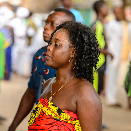 OUIDAH, BENIN - Jan 10, 2017: Unidentified Beninese woman in national suit looks ahead at the voodoo festival, which is anually celebrated on January, 10th.のeditorial素材