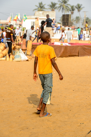 OUIDAH, BENIN - Jan 10, 2017: Unidentified Beninese  little boy from behind at the voodoo festival, which is anually celebrated on January, 10th.のeditorial素材