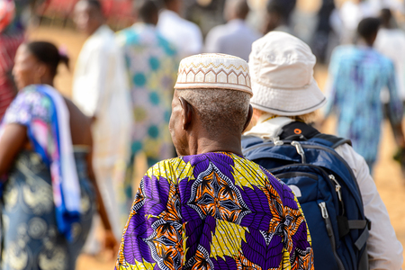 OUIDAH, BENIN - Jan 10, 2017: Unidentified Beninese  old man in national suit from behind at the voodoo festival, which is anually celebrated on January, 10th.のeditorial素材