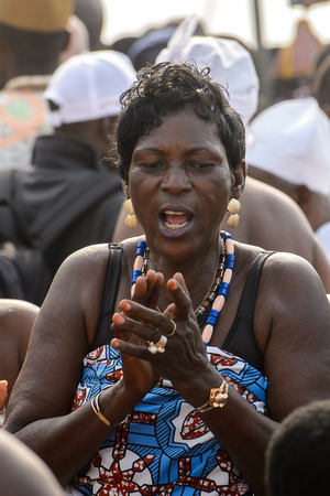 OUIDAH, BENIN - Jan 10, 2017: Unidentified Beninese woman in national suit wears necklace and earings at the voodoo festival, which is anually celebrated on January, 10th.のeditorial素材